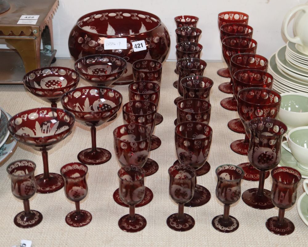 A quantity of cranberry glassware